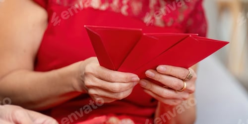 Preview: Elderly couple celebrating chinese new year home interior event festive atmosphere close-up view