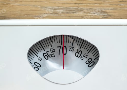 Preview: Closeup of weight scales overweight and obesity concept
