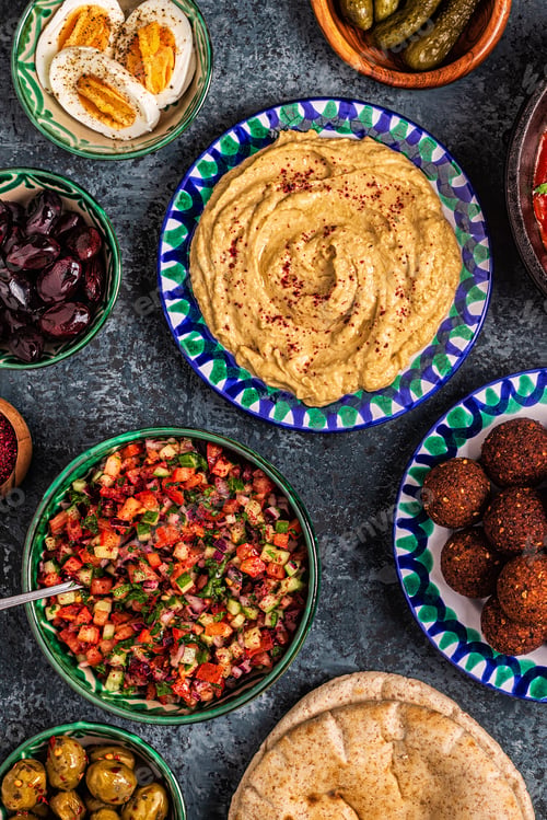 Preview: Falafel, hummus, shakshuka, Israeli salad - traditional dishes of Israeli cuisine.