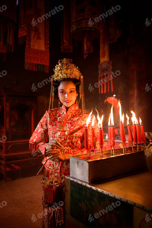 Preview: Chinese woman make wishes, pray, and light candles.