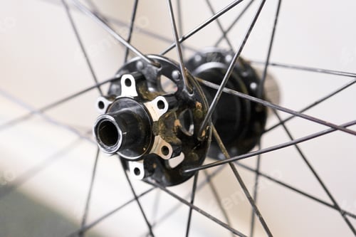 Preview: Closeup of a bicycle hub under the lights against a blurry background
