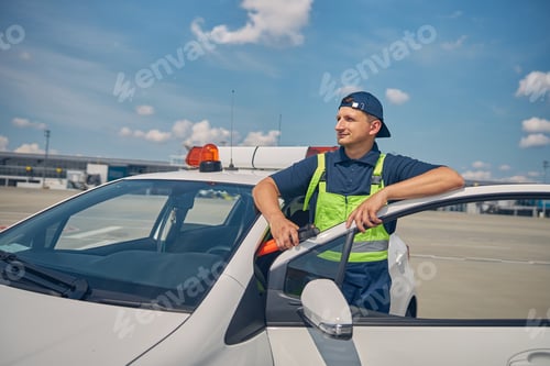 Preview: Pensive aircraft worker looking into the distance