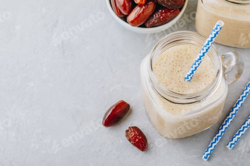 Preview: Banana and date fruit smoothie or milkshake in glass mason jar