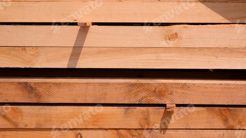 Preview: Group of big hardwood timbers stacked in horizontal pattern, construction material background