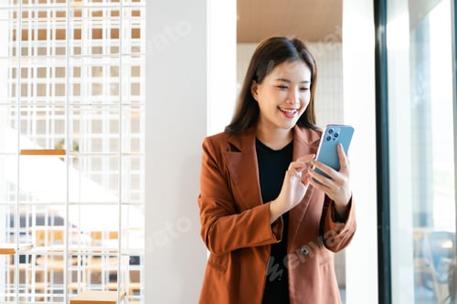 Preview: Young attractive Asian female office worker business suits smiling at camera in office
