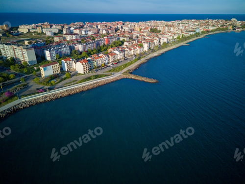 Preview: Promenade with people walking near Black Sea against backdrop of town Pomorie in Bulgaria
