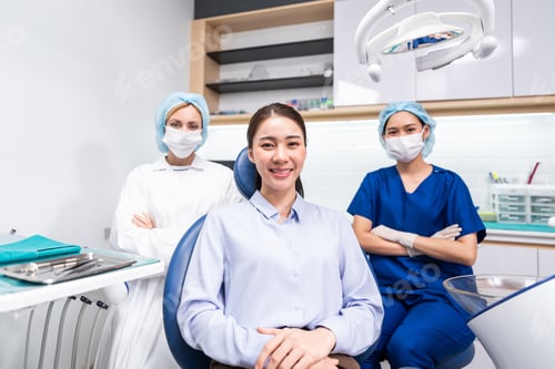 Preview: Portrait of Asian young woman patient and dentist at health care clinic.