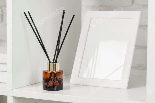 Preview: Elegant Reed Diffuser on White Shelf in a Modern Minimalist Interior Setting