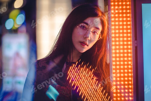 Preview: Pretty asian woman portrait with led lights