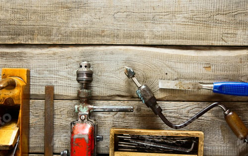 Preview: Various tools on a wooden background.