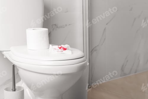 Preview: Sheet of paper with blood on toilet bowl in bathroom