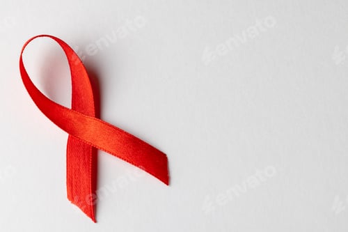 Preview: Composition of red ribbon for hiv or aids awareness, on white background with copy space