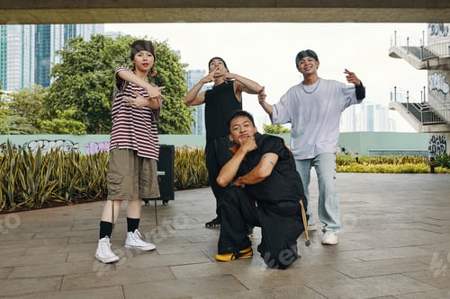 Preview: Group of Young Friends Posing Outdoors Under Pavilion