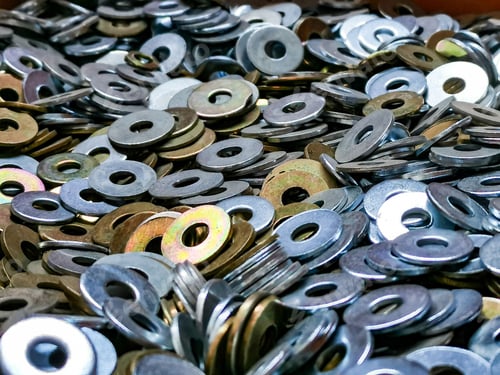 Preview: Closeup shot of a pile of metallic silver flat washers