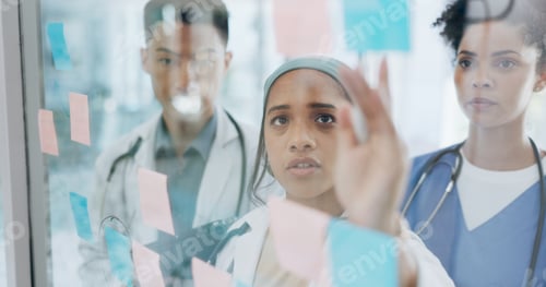 Preview: Meeting, medical and collaboration with a doctor black woman coaching her team on glass in a hospit