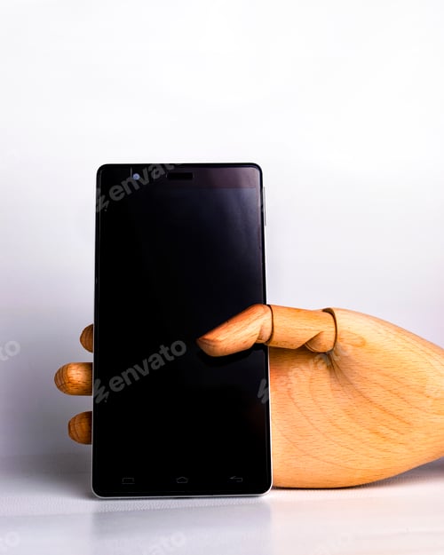 Preview: Wooden hand fastened a black mobile phone
