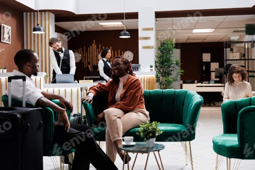Preview: African american people sitting in lobby