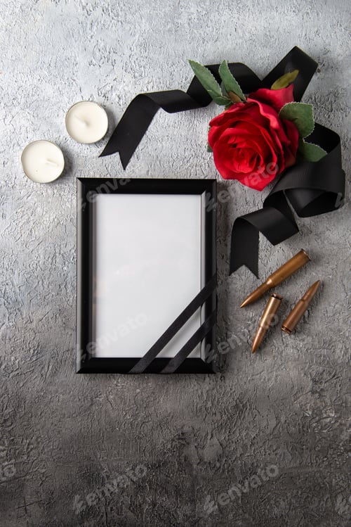 Preview: top view of red flower with picture frame on light surface war soldier tank death