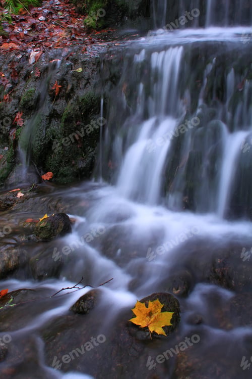 Preview: Beautiful autumn landscape with a waterfall in the autumn forest