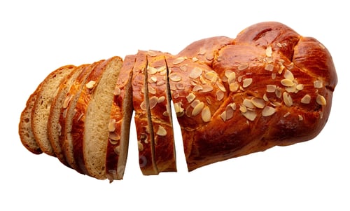 Preview: Easter greek tsoureki braid sliced isolated on white, Sweet bread brioche cut, top view