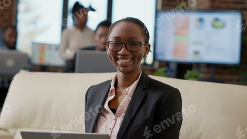Preview: Portrait of female employee working as executive manager
