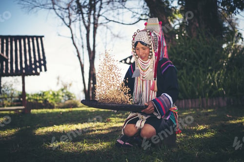 Preview: Akha in the north of Thailand enjoying coffee from shell by bamboo basket with traditional cloth.