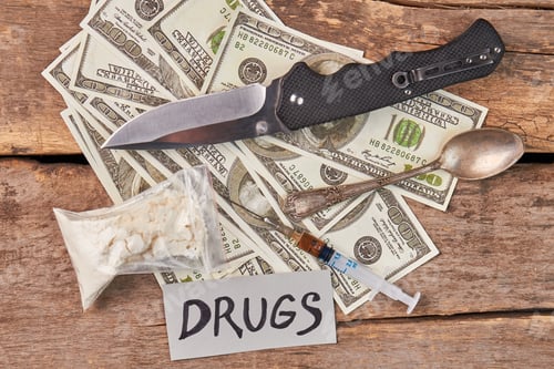Preview: Money, Knife, and Syringe on Weathered Wooden Surface