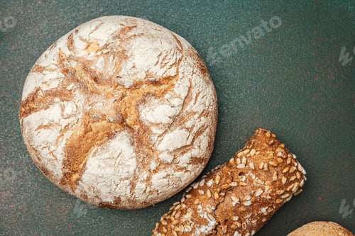 Preview: Freshly baked bread varieties on a rustic surface in natural light