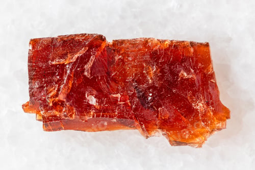 Preview: sample of raw villiaumite mineral on white marble