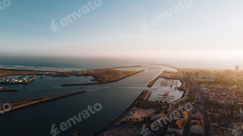 Preview: Beautiful view of a city with a sea under the clear blue sky