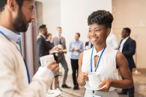 Preview: business people with conference badges and coffee