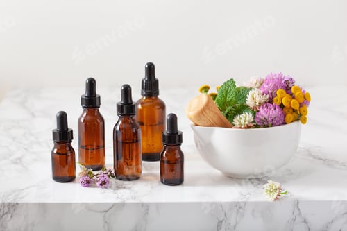 Preview: medical flowers herbs in mortar essential oils in bottles. alter