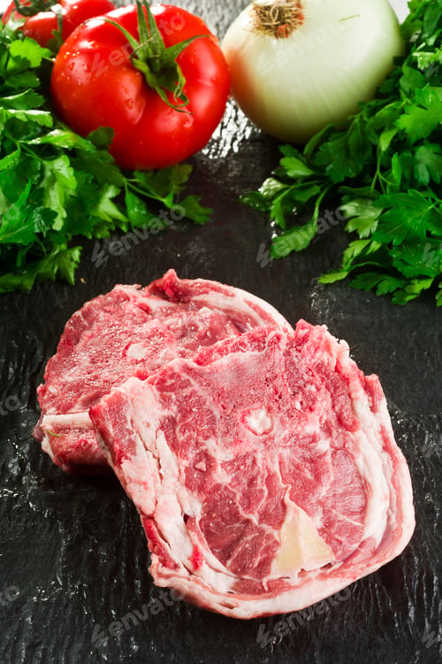 Raw Beef Steaks with Tomatoes and Fresh Herbs