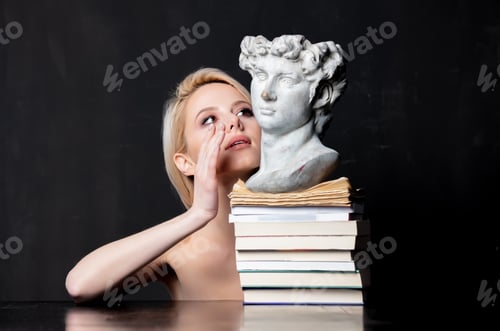 Preview: blonde next to an antique bust of a man on books