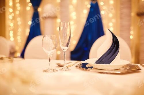 Preview: Elegantly decorated table setting for event. dishes, wine glasses
