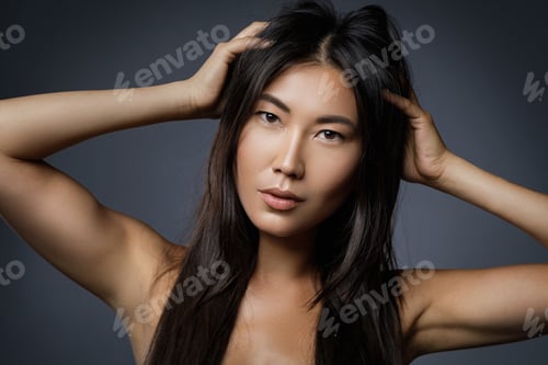 Preview: Beautiful asian woman with a black healthy hair
