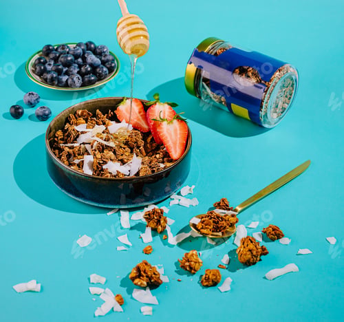 Preview: A colorful display of granola topped with strawberries and coconut flakes