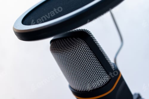 Preview: Closeup of a black and grey microphone captured on a white background