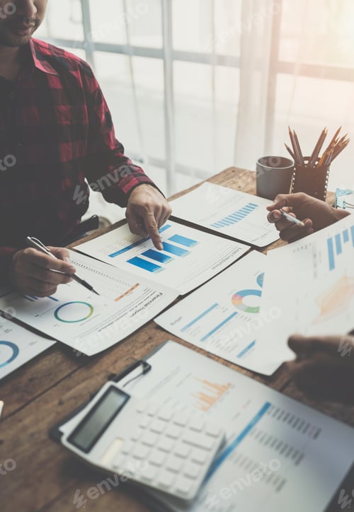 Preview: Business people meeting explaining the financial graph data and marketing plan. Group of business pe