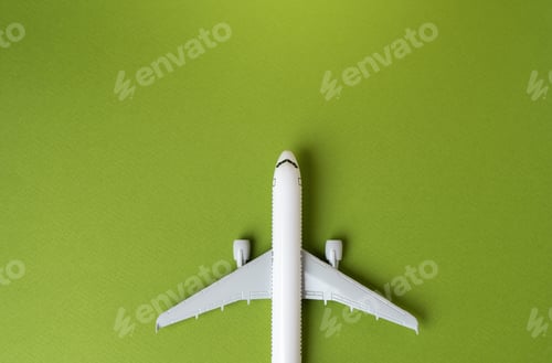 Preview: Airline plane top view on green background.