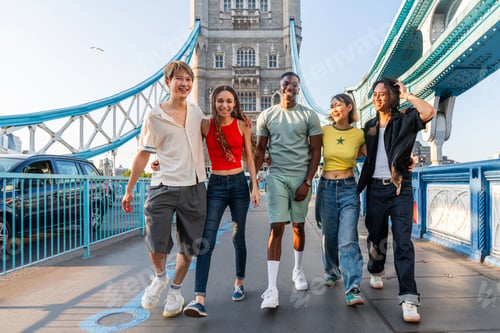 Preview: Multiracial group of happy young friends bonding in London