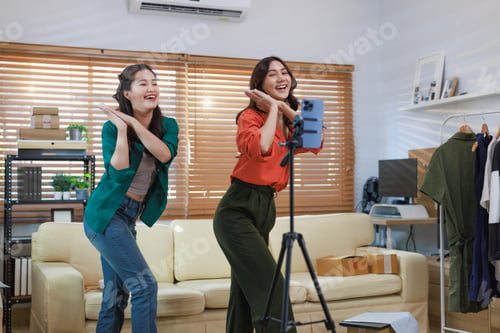 Preview: Asian women live streaming fashion clothing for social media
