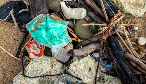 Preview: Garbage from used medical masks and gloves on the beach. Pollution ocean