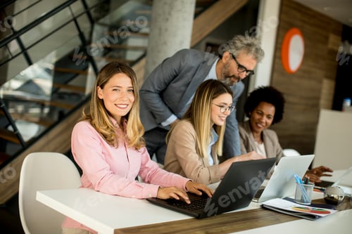 Preview: Group of young multiethnic business people working on new project