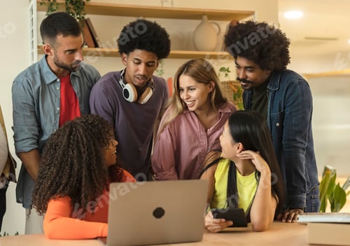 Preview: group of young multiracial students in front of laptop doing a project for college class