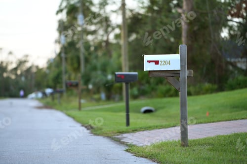 Preview: Typical american outdoors mail box on suburban street side