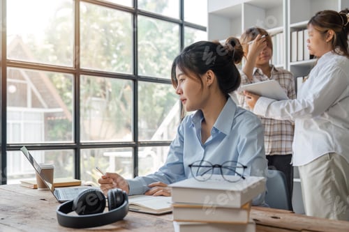 Preview: cute stylish female student, studying remotely from home, using a laptop, taking notes on notepad