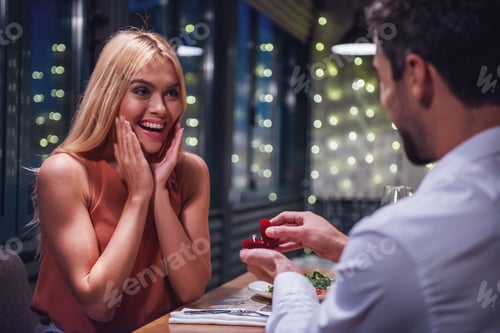 Preview: Man proposing in restaurant
