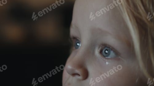Preview: Baby girl staring at TV screen being attracted with something curious
