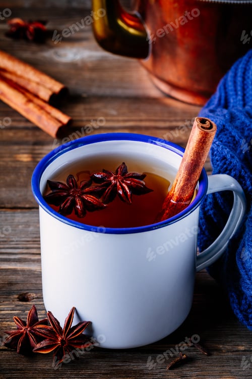 Preview: Autumn hot tea with spices cinnamon and anise in mug
